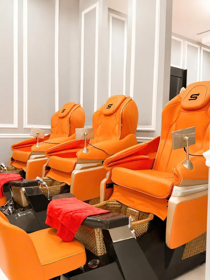 Orange pedicure chairs row Hamburg NY